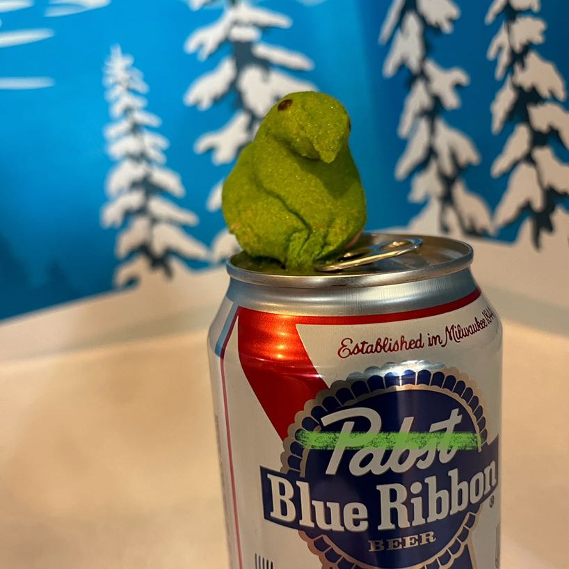 Green chick Peep posted on a can of PBR